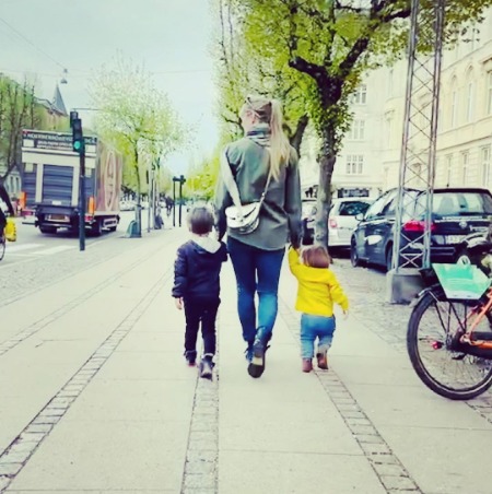 Eugene Isaac walking with his mother Elvira Lind and Mads Isaac.
